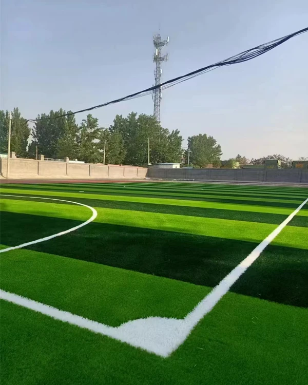A sample of artificial turf with three colors